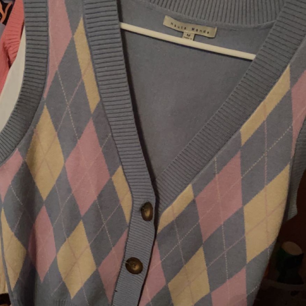 A medium blue v-neck vest